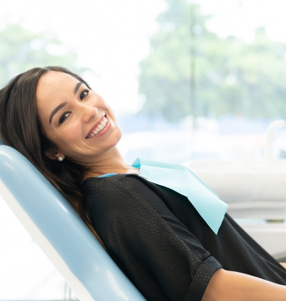 Smiling woman outside with healthy teeth